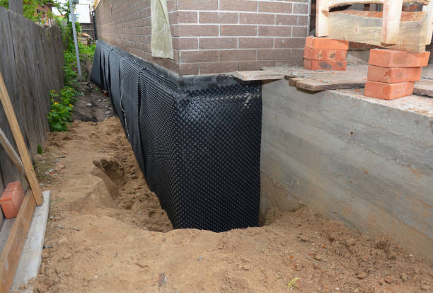 Happy homeowners after waterproofing job in Celina